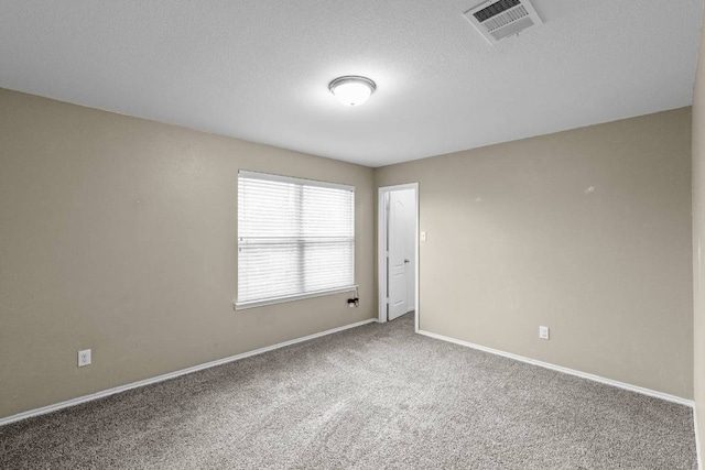 2202 Kuykendall Dr, Georgetown, TX 78626 - empty room featuring carpet and a textured ceiling