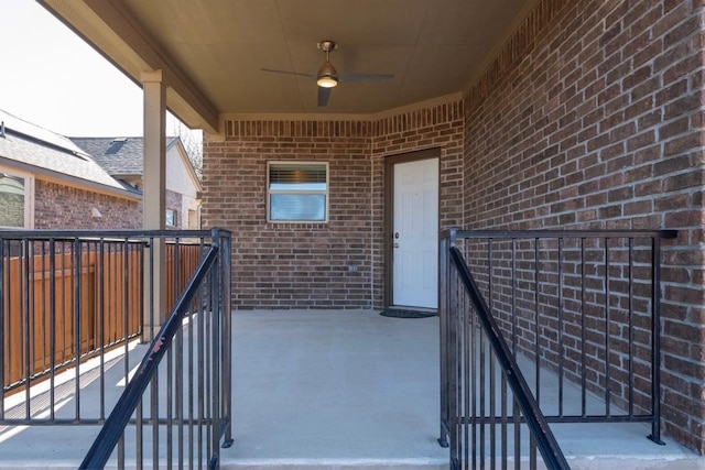 view of patio / terrace featuring ceiling fan and fence