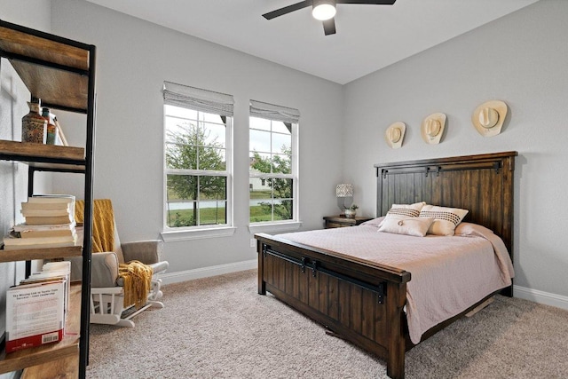 bedroom featuring carpet, a ceiling fan, and baseboards