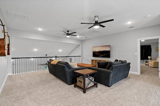 living area featuring light carpet, ceiling fan, visible vents, and baseboards