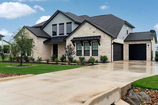 view of front of home with roof with shingles, concrete driveway, a standing seam roof, metal roof, and a front lawn