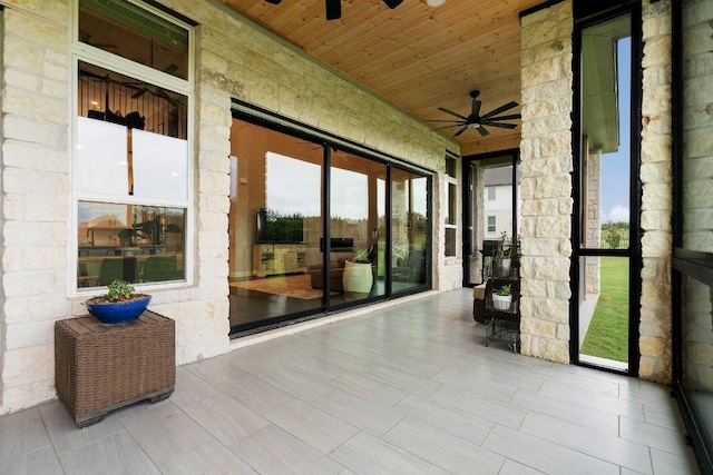 exterior space with ceiling fan