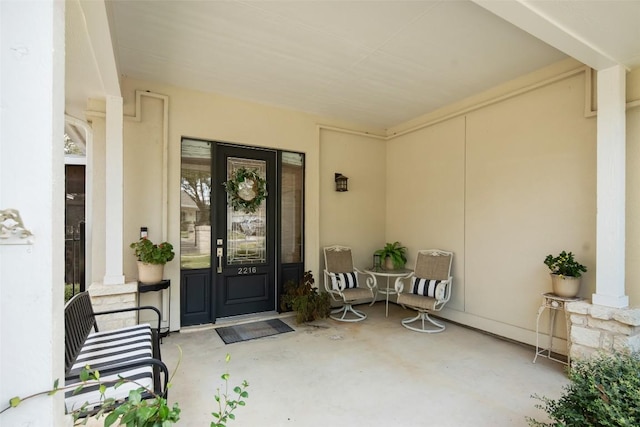 entrance to property featuring stucco siding