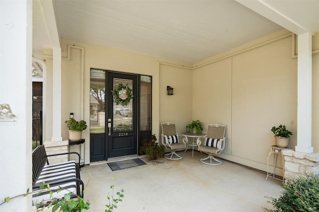 2216 Garden Ct, San Marcos, TX 78666 - doorway to property with stucco siding and covered porch
