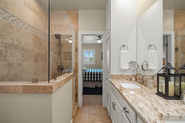 2216 Garden Ct, San Marcos, TX 78666 - ensuite bathroom with a walk in shower, vanity, tile patterned floors, and a ceiling fan