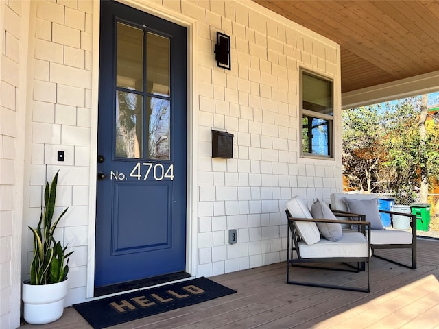 doorway to property featuring a porch