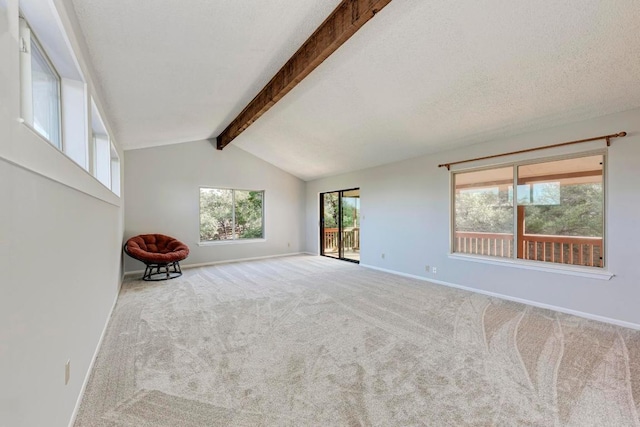 4113 Rimrock Dr, Lago Vista, TX 78645 - carpeted empty room with vaulted ceiling with beams, a textured ceiling, and baseboards