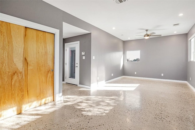 spare room featuring a ceiling fan, recessed lighting, visible vents, and baseboards