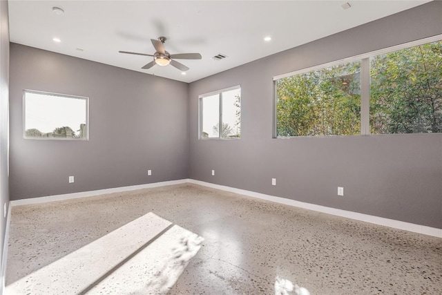 spare room with baseboards, visible vents, ceiling fan, speckled floor, and recessed lighting