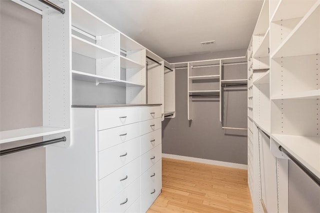 spacious closet with visible vents and light wood-style flooring