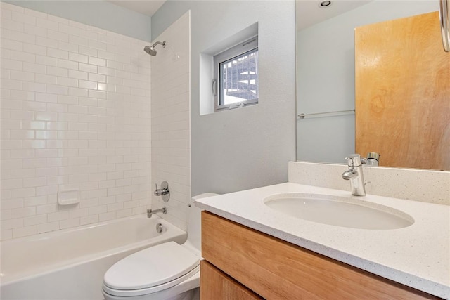 full bath featuring tub / shower combination, vanity, and toilet