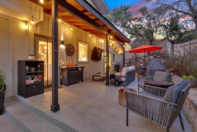 view of patio featuring an outdoor living space and fence