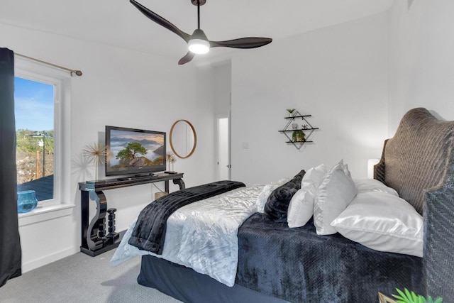 bedroom featuring baseboards, a ceiling fan, and carpet flooring