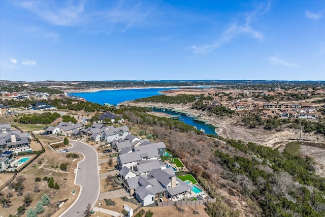 aerial view with a water view and a residential view