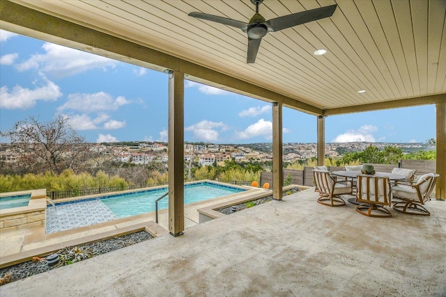 view of swimming pool with a fenced in pool, outdoor dining area, and a patio area