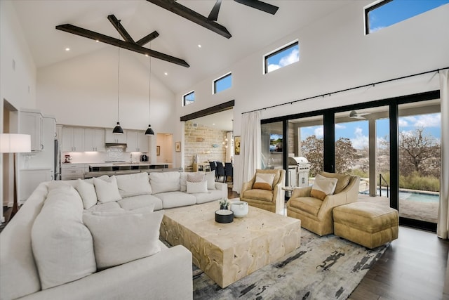 living area featuring ceiling fan, high vaulted ceiling, recessed lighting, wood finished floors, and beam ceiling