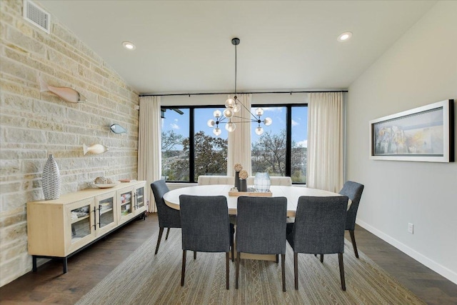 dining space with dark wood-style floors, recessed lighting, visible vents, a chandelier, and baseboards