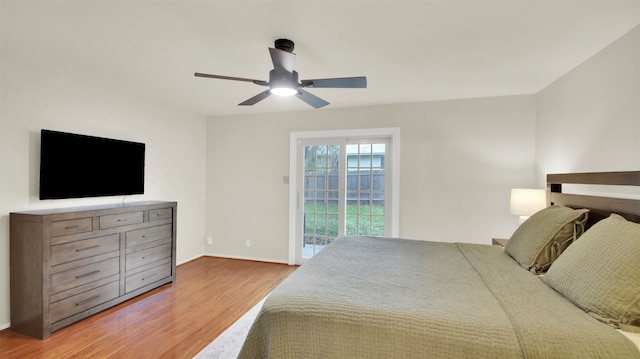 bedroom with access to outside, baseboards, ceiling fan, and wood finished floors