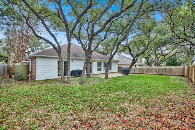 view of yard featuring a patio area and a fenced backyard