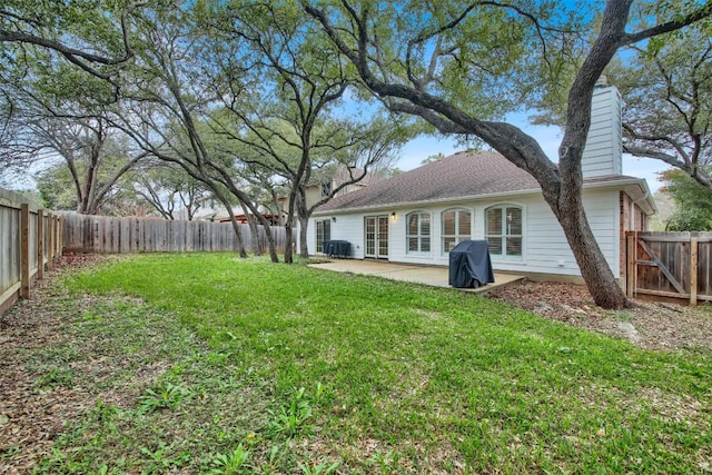 view of yard featuring a patio and a fenced backyard