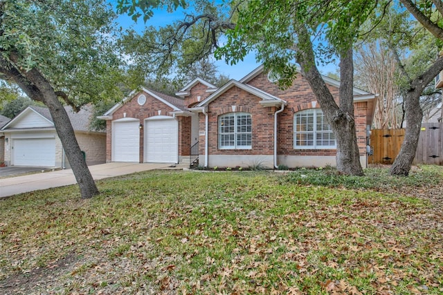 single story home with an attached garage, brick siding, fence, concrete driveway, and a front lawn