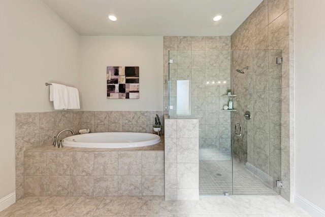 bathroom with a stall shower, a bath, and tile patterned floors