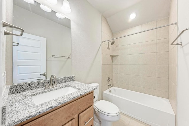 bathroom with tile patterned flooring, shower / bath combination, vanity, and toilet