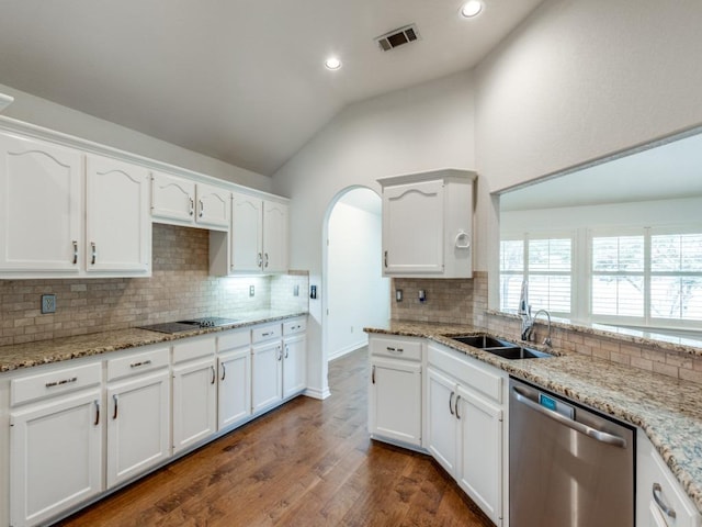 kitchen featuring dark wood finished floors, lofted ceiling, visible vents, white cabinets, and dishwasher