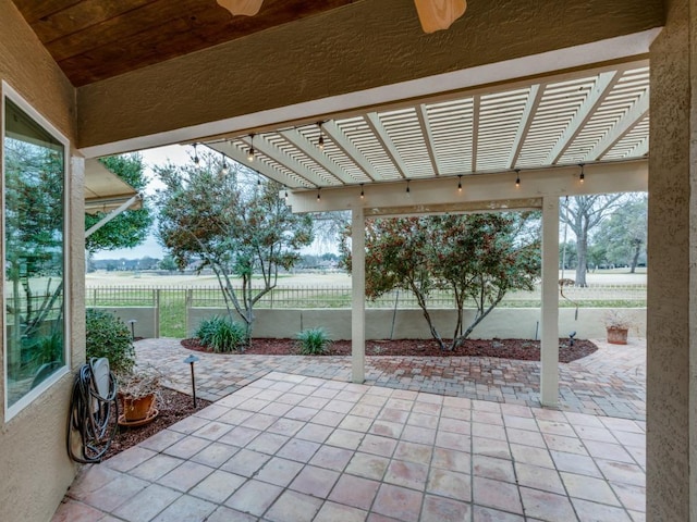 view of patio featuring fence and a pergola