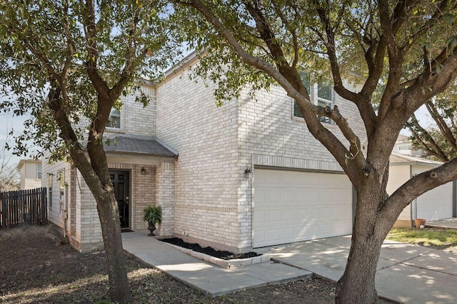 view of front of property with brick siding, a shingled roof, concrete driveway, an attached garage, and fence