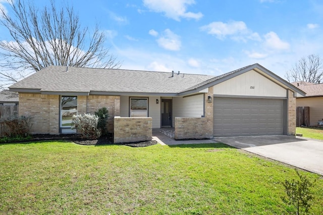 view of front of house with driveway, brick siding, an attached garage, and a front yard