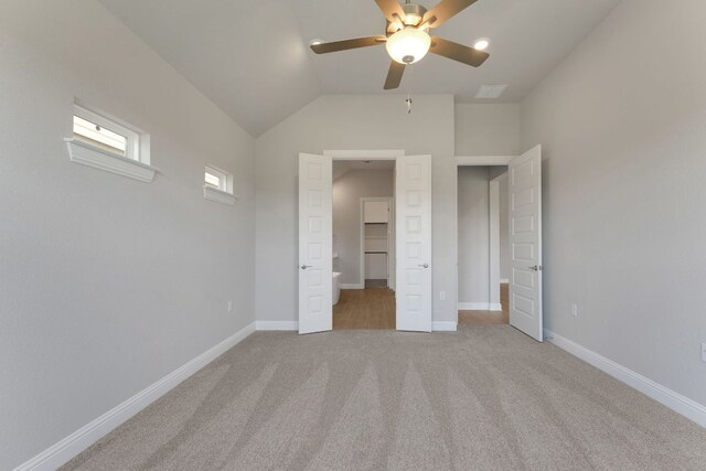 9908 Ephemeral Dr, Manor, TX 78653 - unfurnished bedroom with carpet, vaulted ceiling, and a ceiling fan