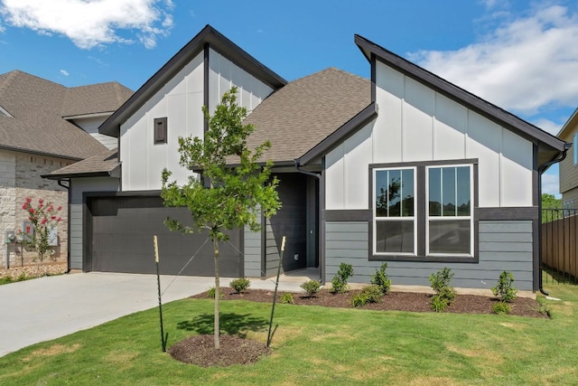 9908 Ephemeral Dr, Manor, TX 78653 - view of front of home featuring driveway, board and batten siding, roof with shingles, and a garage
