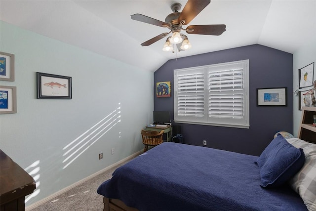 carpeted bedroom with baseboards, vaulted ceiling, and a ceiling fan