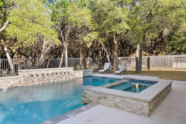 view of swimming pool with a fenced backyard, a fenced in pool, and an in ground hot tub