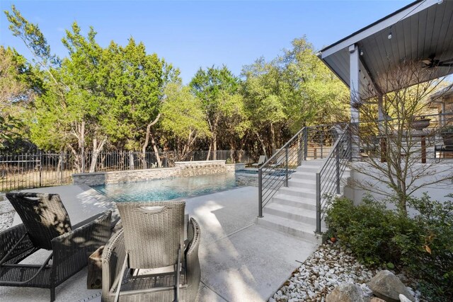 22128 Rose Grass Ln, Spicewood, TX 78669 - view of swimming pool with stairway, a fenced backyard, a patio area, and a ceiling fan