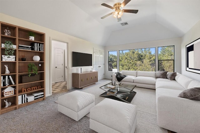 living area featuring ceiling fan, built in shelves, carpet flooring, visible vents, and vaulted ceiling