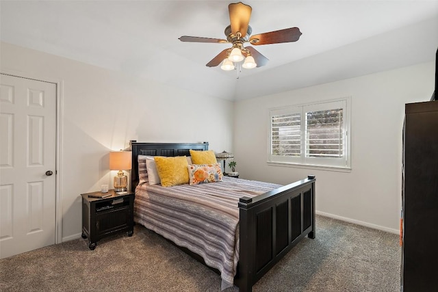 bedroom with vaulted ceiling, ceiling fan, carpet, and baseboards