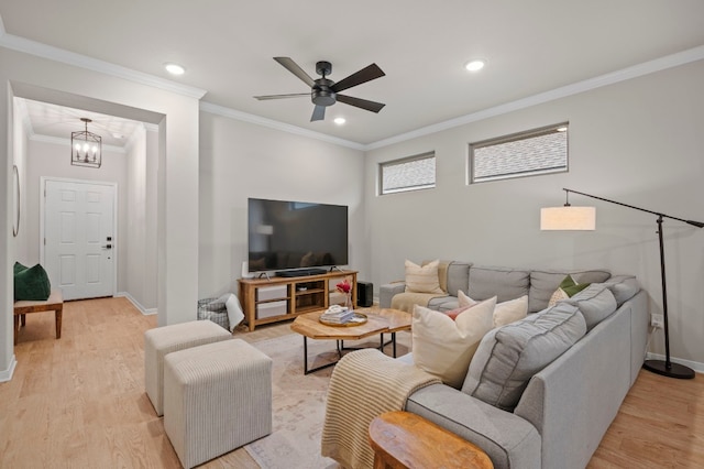 living room featuring baseboards, ornamental molding, recessed lighting, and light wood-style floors