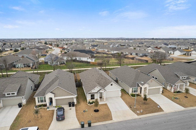 birds eye view of property with a residential view