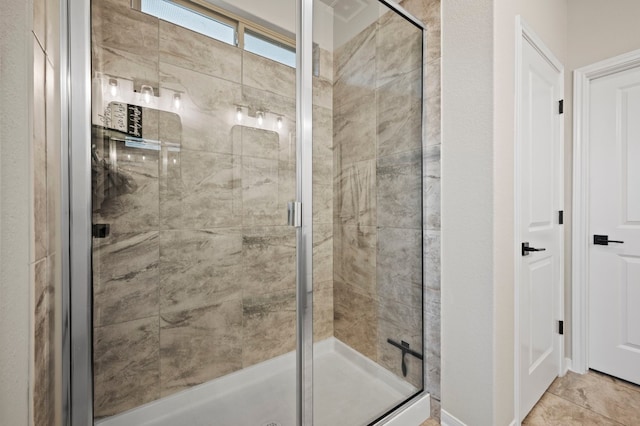 bathroom featuring a shower stall