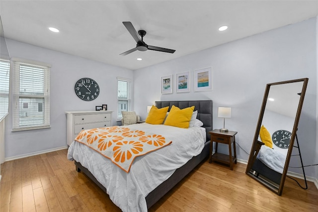 bedroom with recessed lighting, baseboards, hardwood / wood-style floors, and ceiling fan