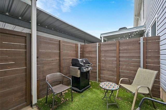 view of patio / terrace featuring fence and grilling area