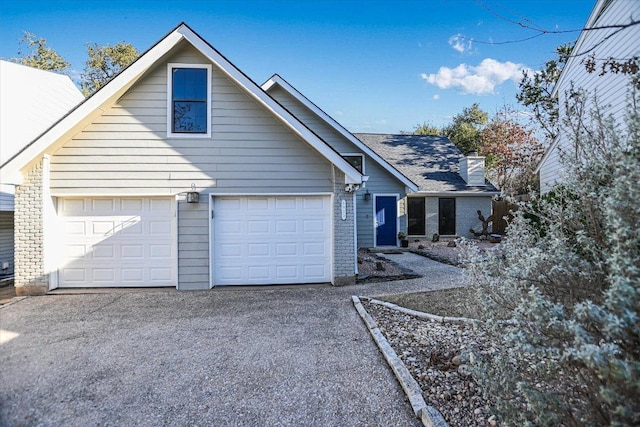 view of front facade with a garage and driveway