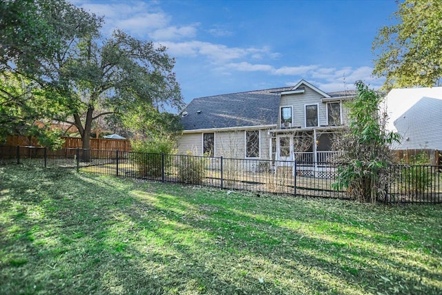 back of property featuring a patio area, a fenced backyard, and a lawn