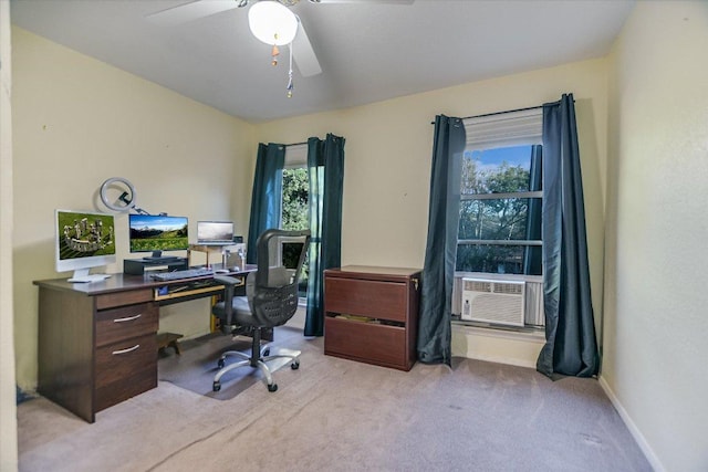 office area with a ceiling fan, cooling unit, baseboards, and carpet flooring