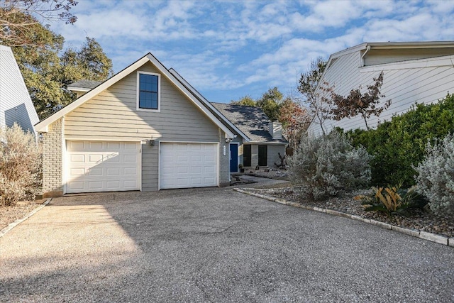 view of home's exterior featuring driveway