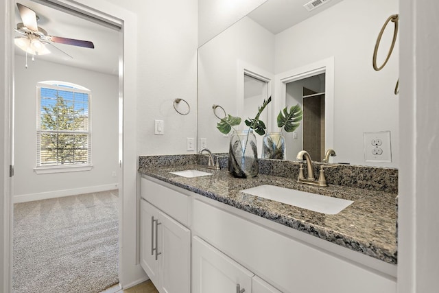 full bath with baseboards, a sink, visible vents, and a ceiling fan