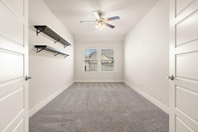 unfurnished room with carpet, vaulted ceiling, ceiling fan, and baseboards