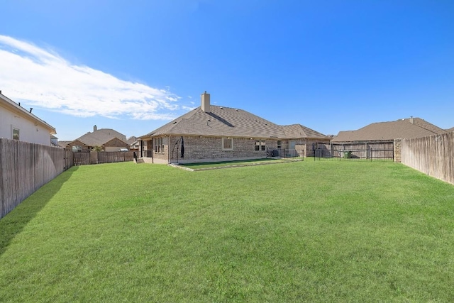 view of yard featuring a fenced backyard